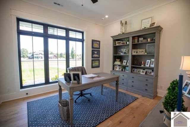 office with crown molding, ceiling fan, and light hardwood / wood-style floors