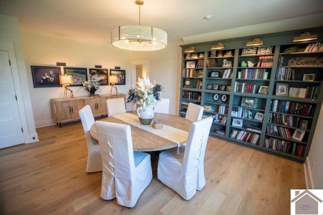 dining space featuring wood-type flooring