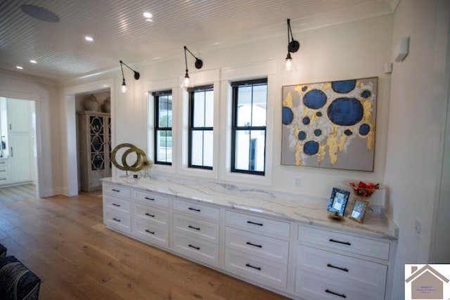 interior space with crown molding and hardwood / wood-style floors