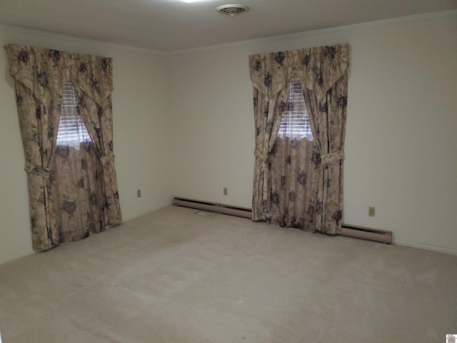 carpeted spare room featuring crown molding and a baseboard radiator