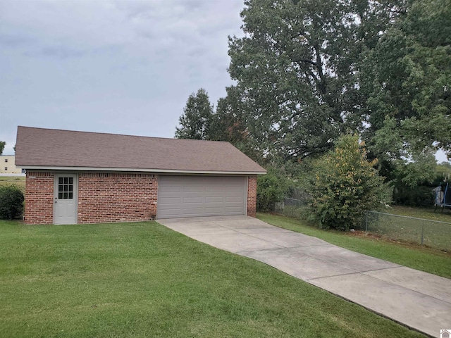 garage with a lawn