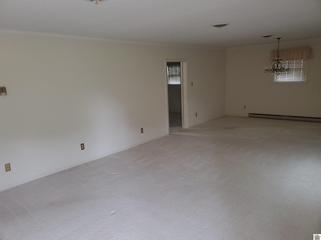 empty room featuring an inviting chandelier, light colored carpet, and a baseboard radiator