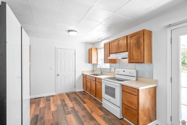 kitchen with sink, white range with electric cooktop, and dark hardwood / wood-style flooring