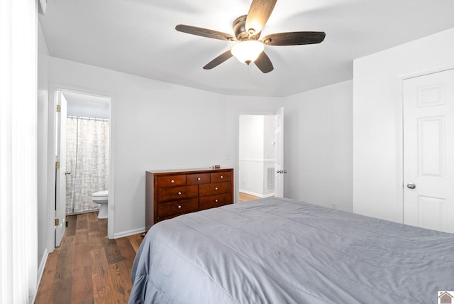 bedroom with ensuite bathroom, ceiling fan, and dark wood-type flooring