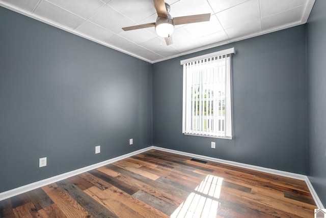 spare room featuring ceiling fan, ornamental molding, and hardwood / wood-style floors