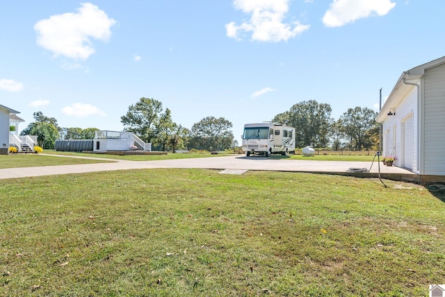 view of yard featuring a garage