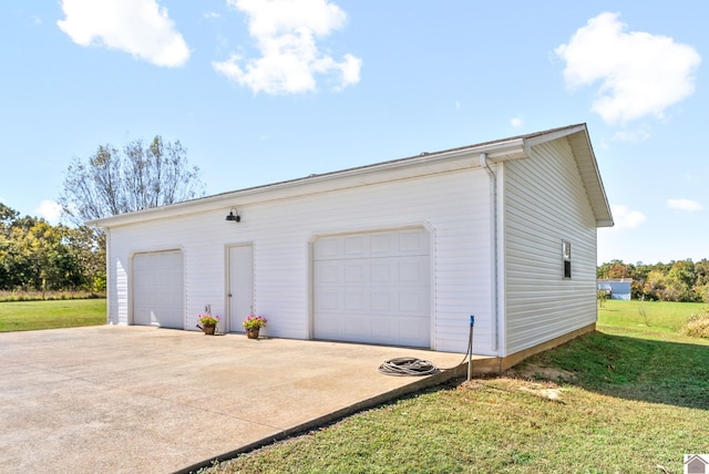 garage featuring a yard