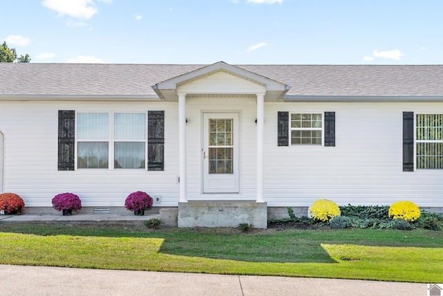 ranch-style home with a front lawn