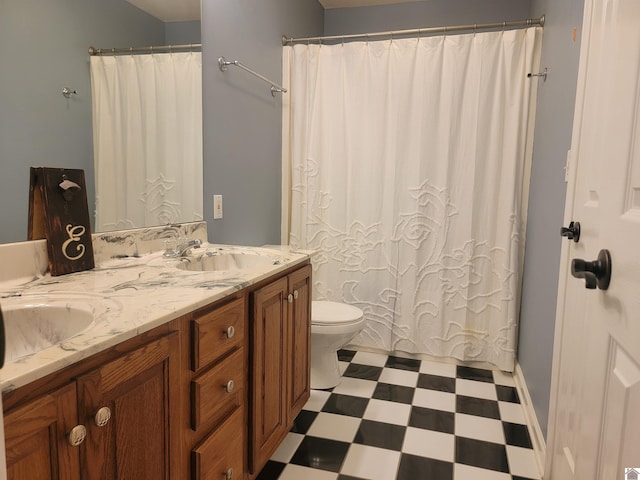 bathroom featuring vanity, toilet, and a shower with curtain