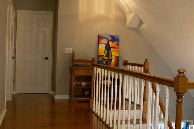 stairs featuring wood-type flooring