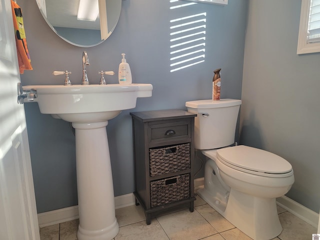 bathroom featuring tile patterned flooring and toilet