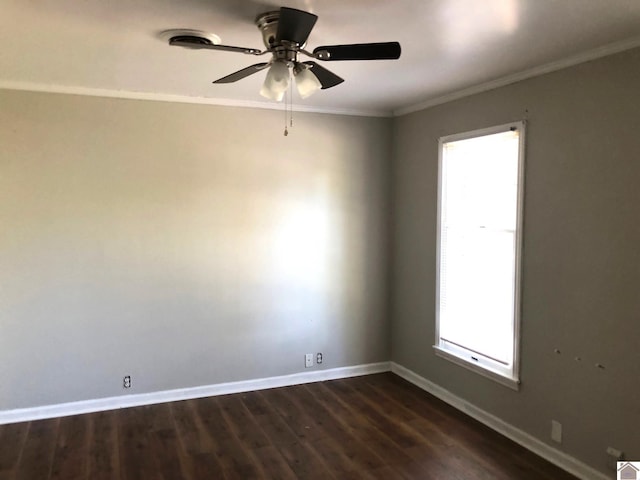 spare room with crown molding, dark hardwood / wood-style floors, and ceiling fan