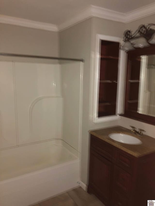 bathroom featuring vanity, ornamental molding, and shower / tub combination