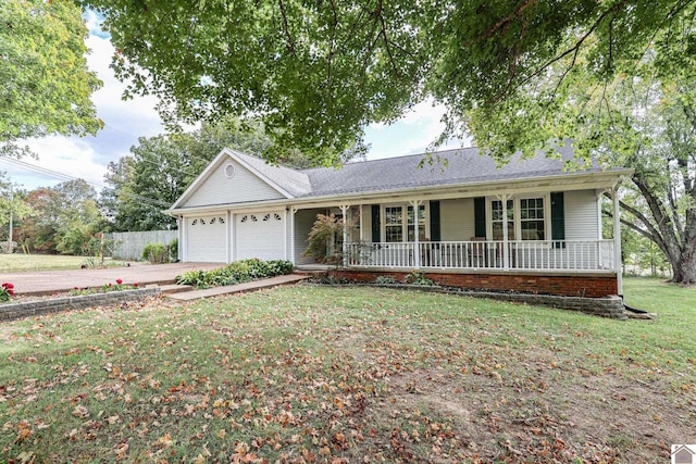 ranch-style home with a garage, a porch, and a front lawn