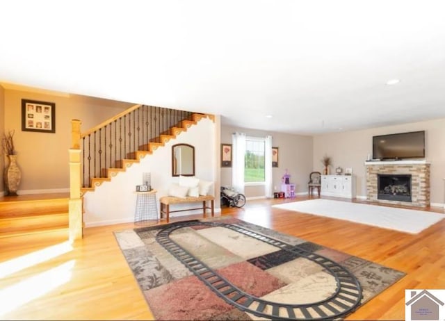 living room with a fireplace and light hardwood / wood-style floors