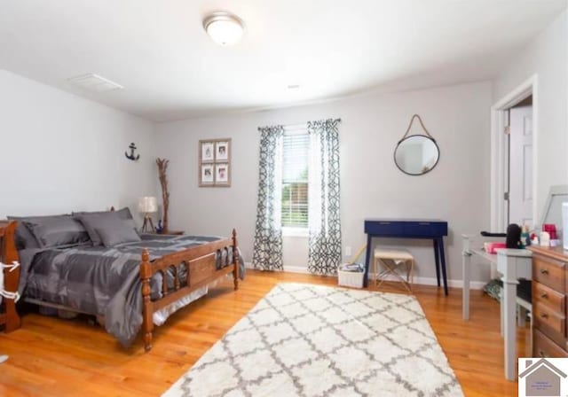 bedroom featuring hardwood / wood-style floors