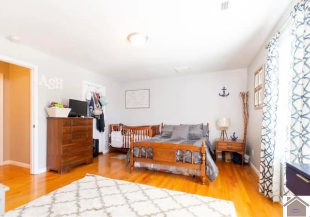 bedroom with hardwood / wood-style floors