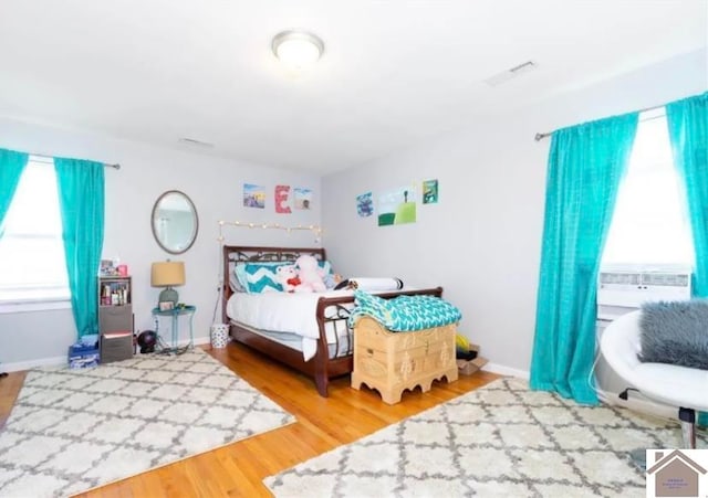 bedroom with hardwood / wood-style floors