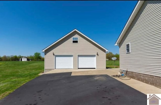 garage with a lawn