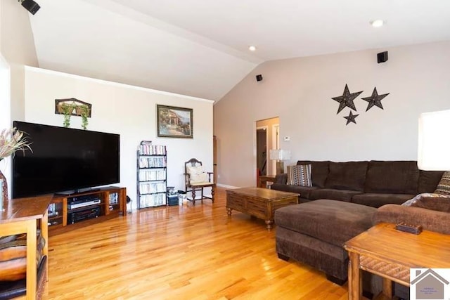 living room with wood-type flooring and vaulted ceiling