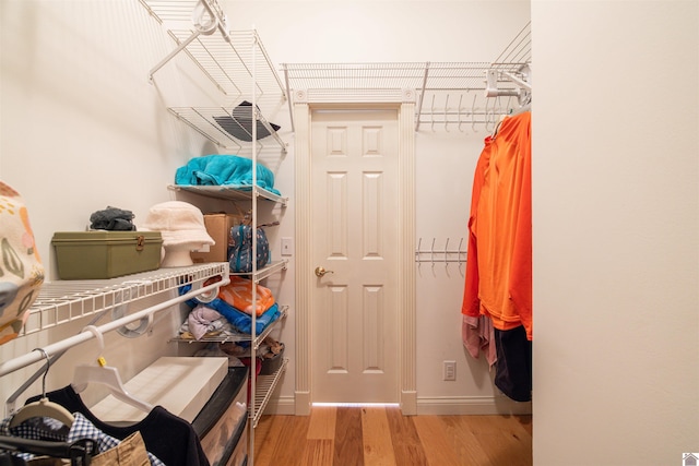 walk in closet featuring light hardwood / wood-style flooring