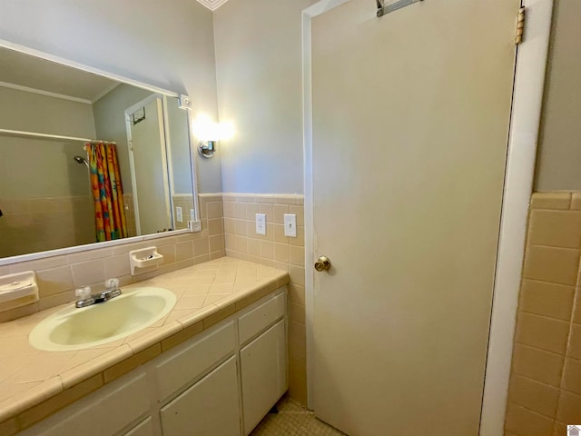 bathroom featuring ornamental molding, tile walls, vanity, and a shower with shower curtain