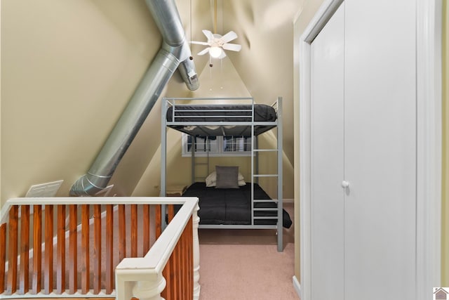 bedroom featuring light carpet and ceiling fan