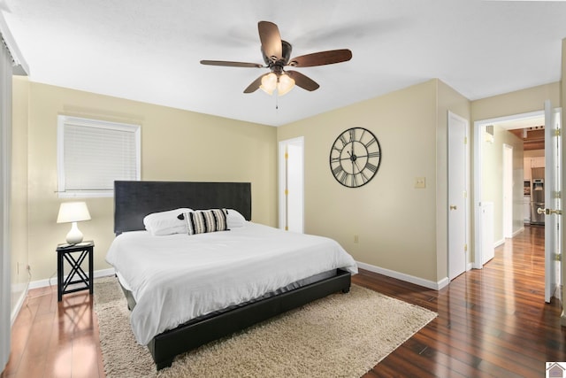 bedroom featuring dark wood-type flooring and ceiling fan