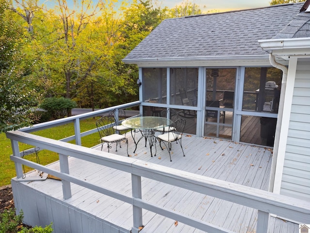 wooden terrace featuring a sunroom