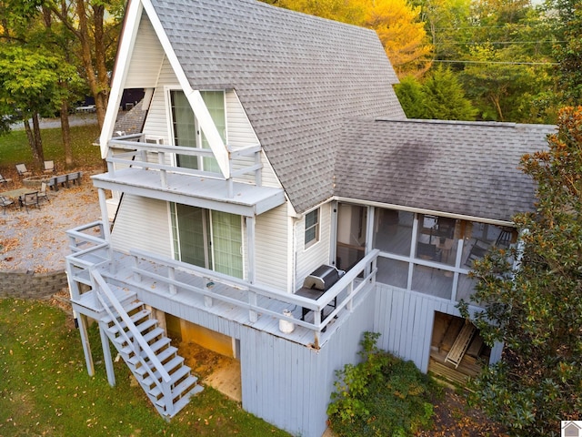 back of house with a sunroom