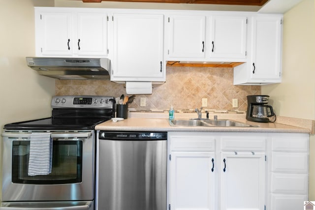 kitchen with backsplash, extractor fan, white cabinetry, sink, and stainless steel appliances