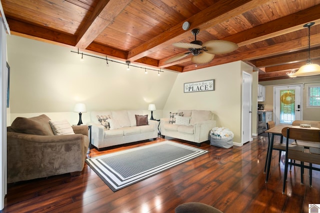 living room with beamed ceiling, dark wood-type flooring, and ceiling fan