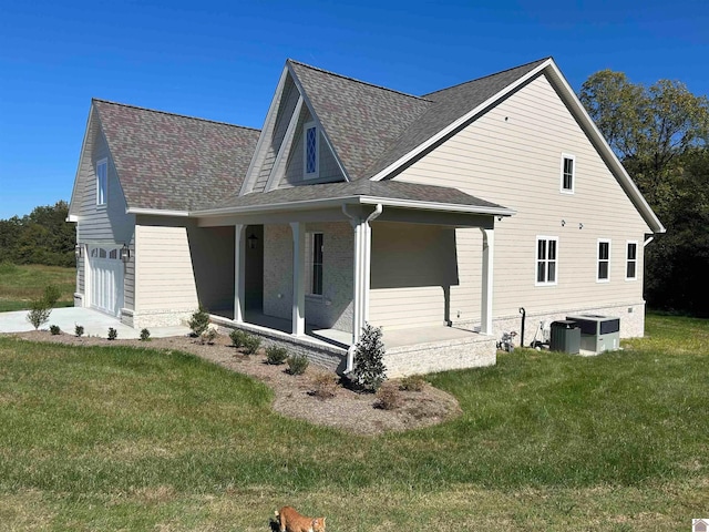 view of side of home with a lawn