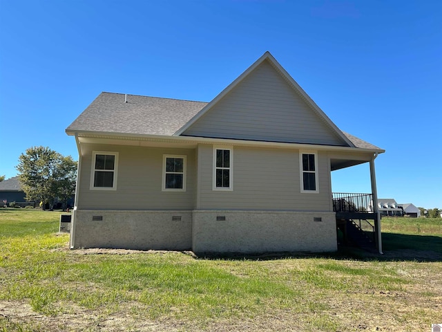 back of house with a yard