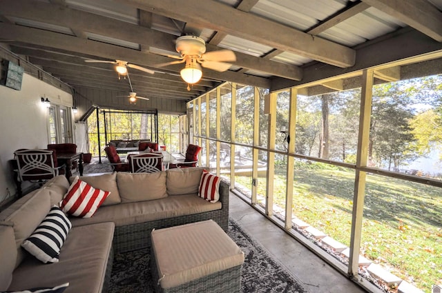 sunroom featuring ceiling fan