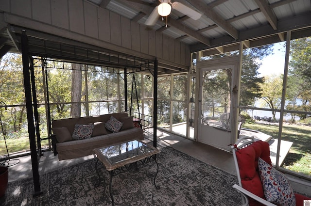 sunroom featuring ceiling fan