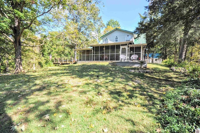 view of yard featuring a sunroom