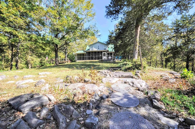 view of yard with a sunroom