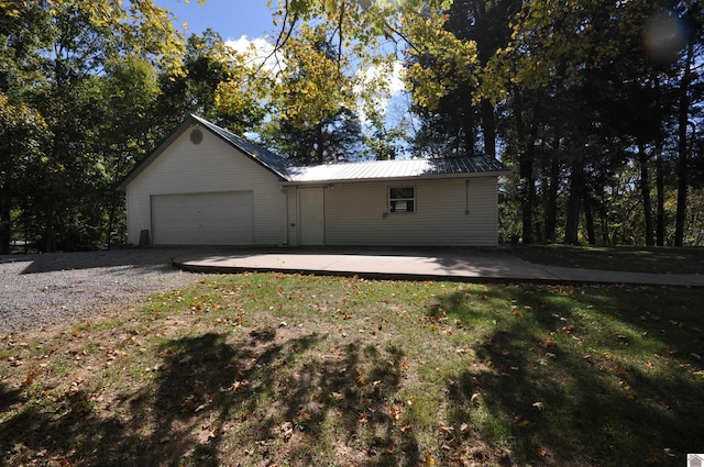 exterior space featuring a front yard and a garage