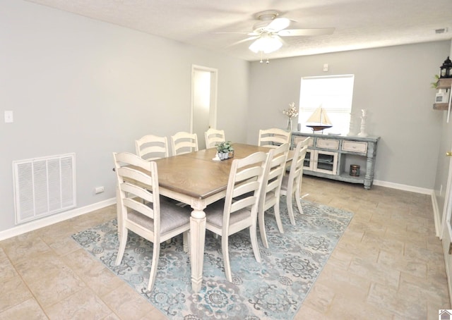 dining space featuring ceiling fan