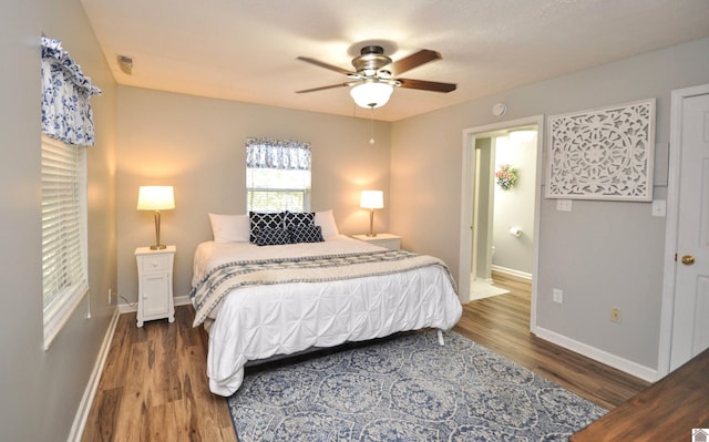 bedroom featuring hardwood / wood-style flooring and ceiling fan