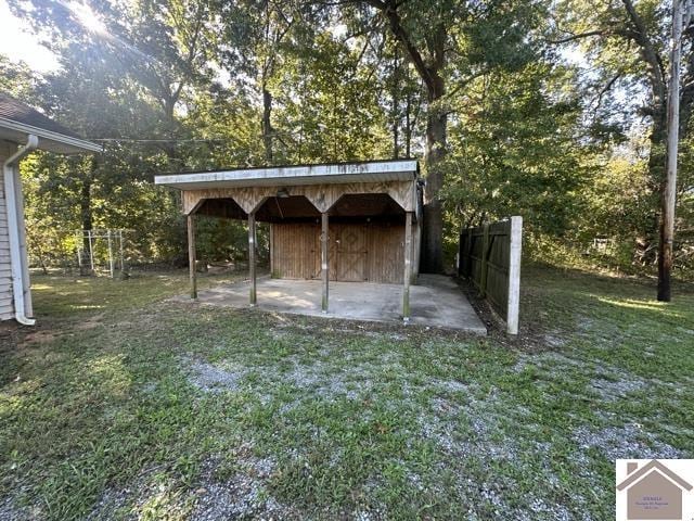 view of outdoor structure with fence