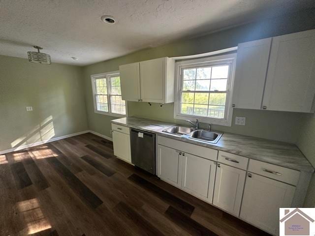 kitchen with sink, white cabinetry, dishwasher, and a healthy amount of sunlight