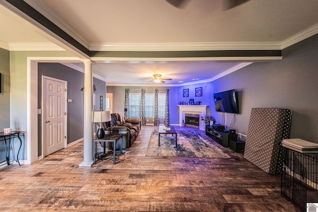 living room featuring ornamental molding, ornate columns, wood-type flooring, and ceiling fan