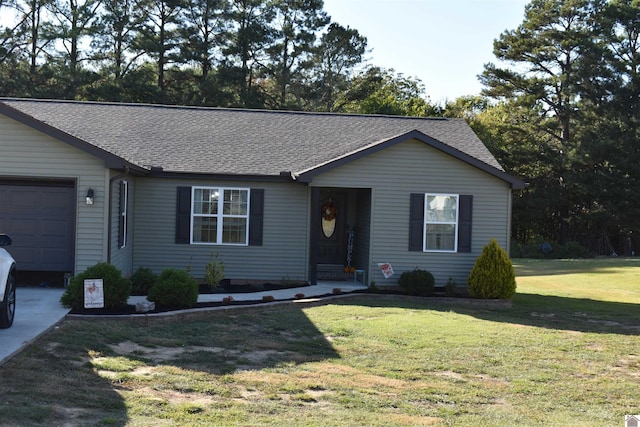 single story home with a garage and a front lawn