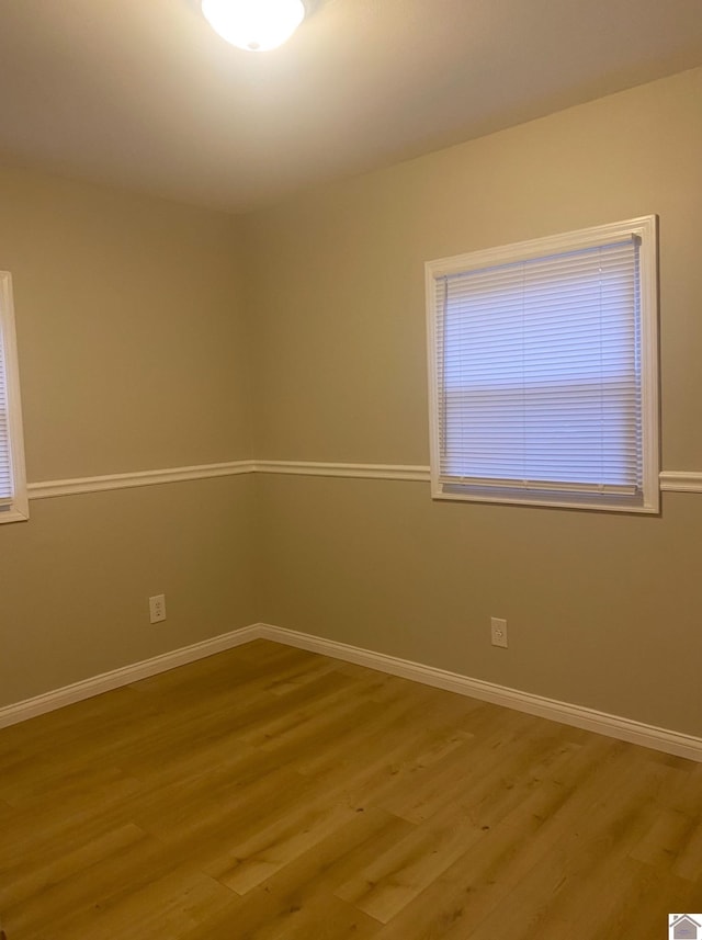 unfurnished room featuring light wood-type flooring