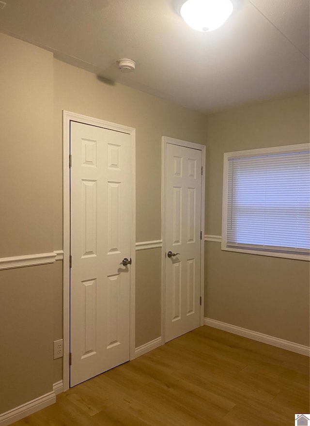 unfurnished bedroom with light hardwood / wood-style flooring