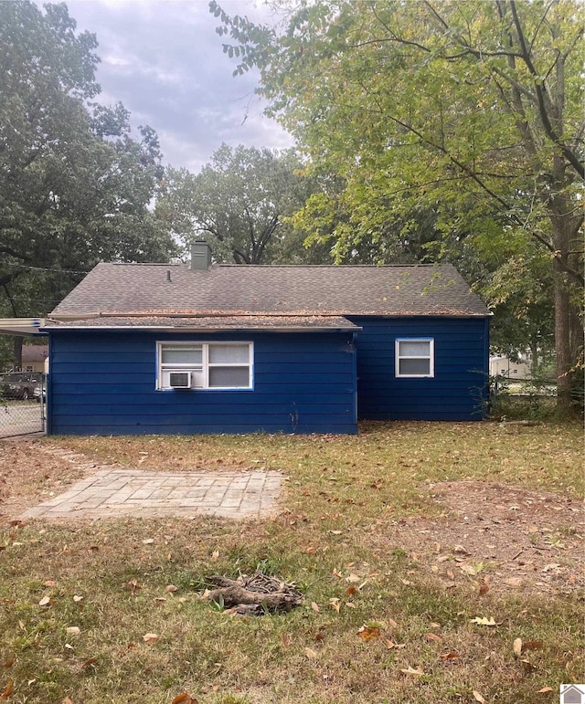 view of home's exterior with a lawn