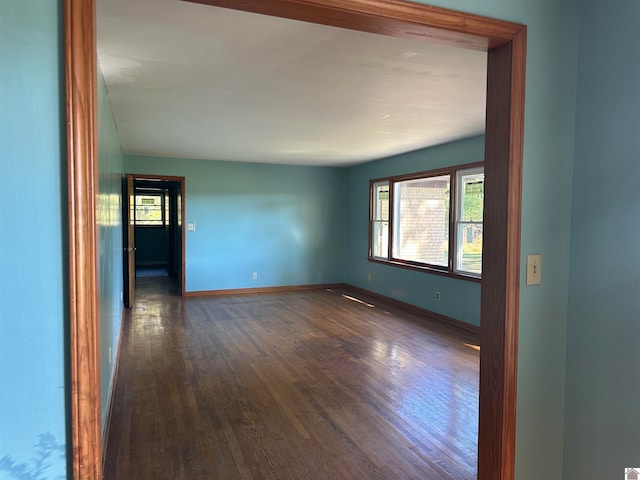 unfurnished room featuring dark hardwood / wood-style floors