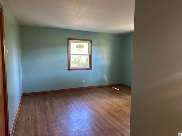 unfurnished room featuring wood-type flooring